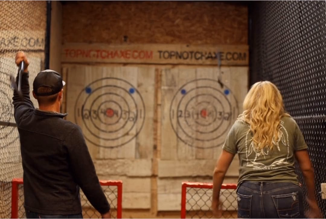 Guests throwing axes at Top Notch Axe Throwing