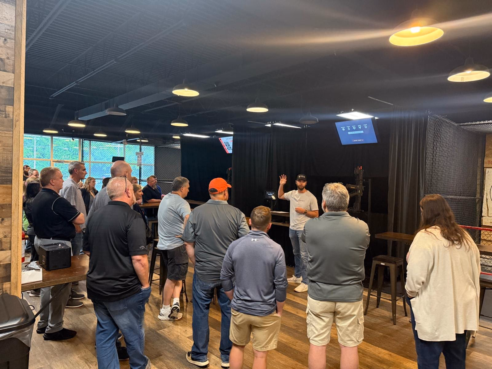 A large group being briefed before play at Top Shot in St. Charles