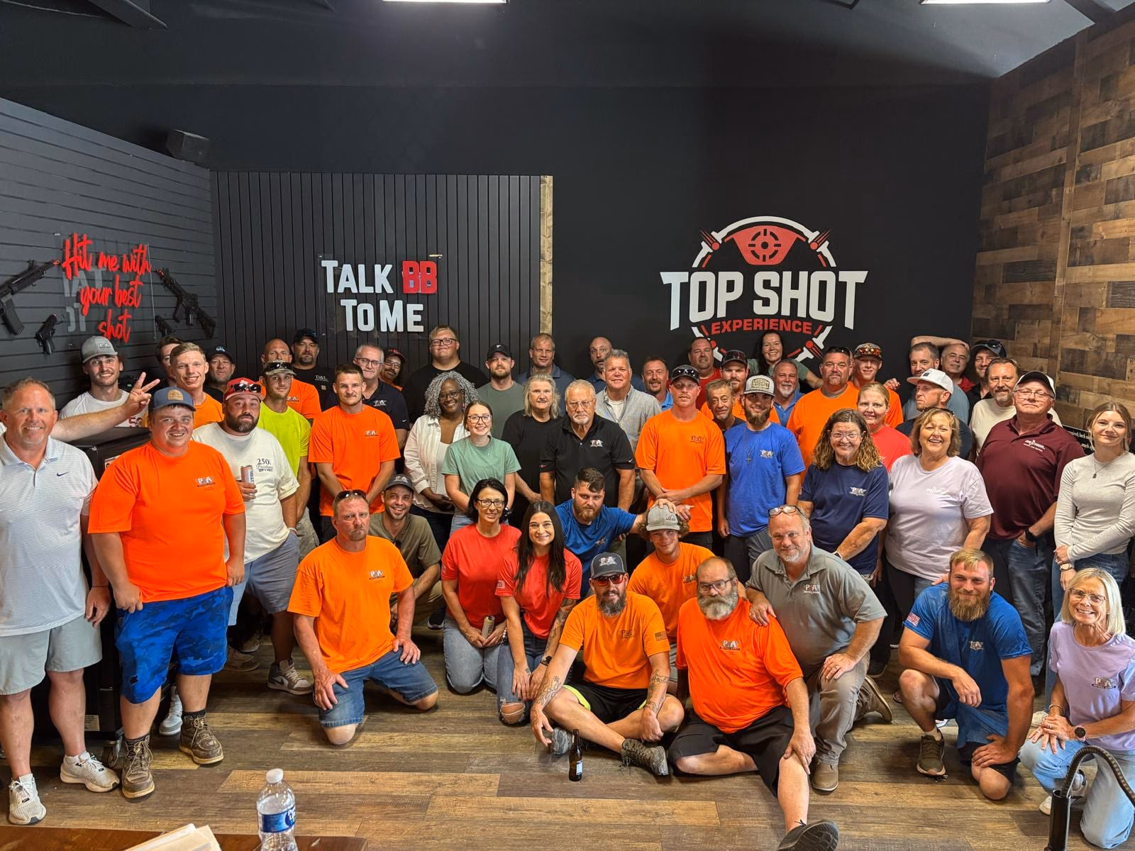 A company group together after a team building event at Top Shot in St. Charles