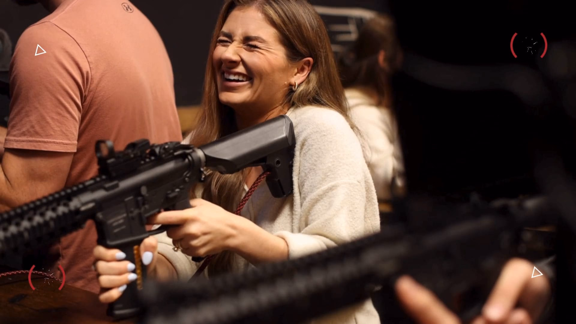 A guest laughing mid-round at Top Shot